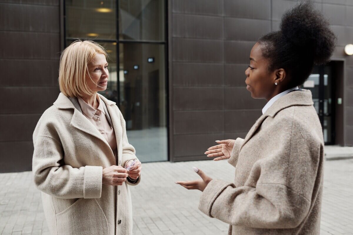 Two women having a chat about how to become a professional coach